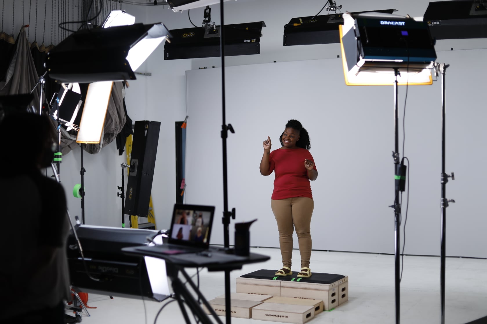 Deaf signer filming ASL content in the DawnSign studio